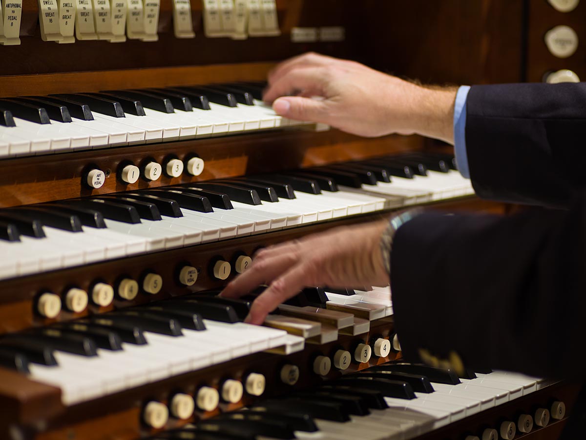 Person playing a musical organ